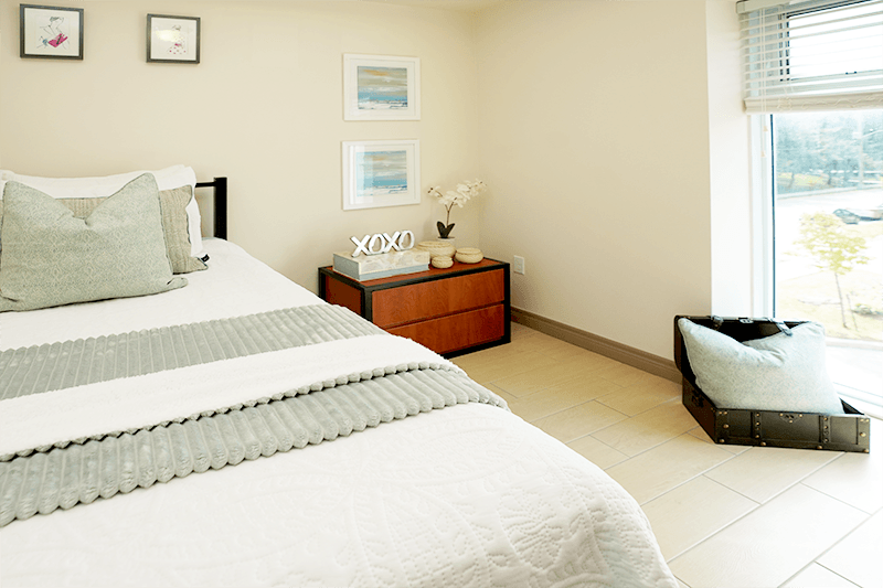 a bedroom with a bed and a window