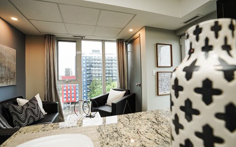 Modern living room with city views at 246 Albert Inc. Apartments, Waterloo, ON N2L 0G5