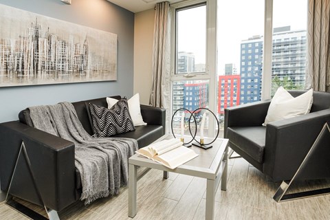 Contemporary living room with city views at 246 Albert Inc. Apartments, Waterloo, Ontario
