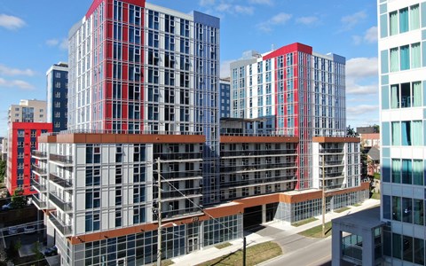 an aerial view of a cluster of tall buildings in a city