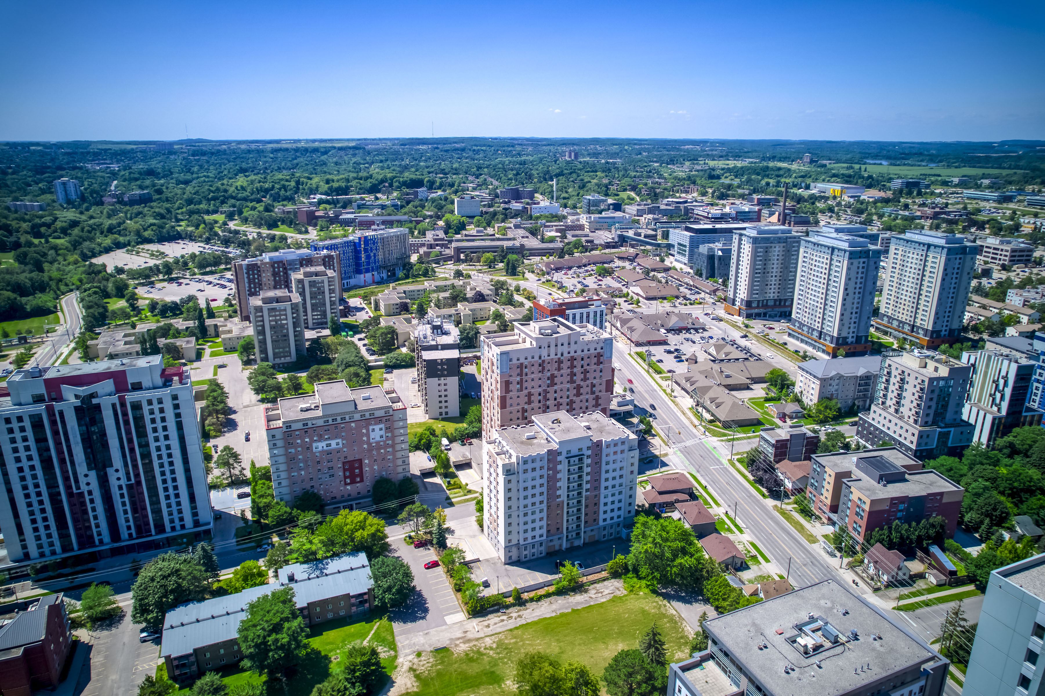 A cityscape with a mix of residential and commercial buildings.