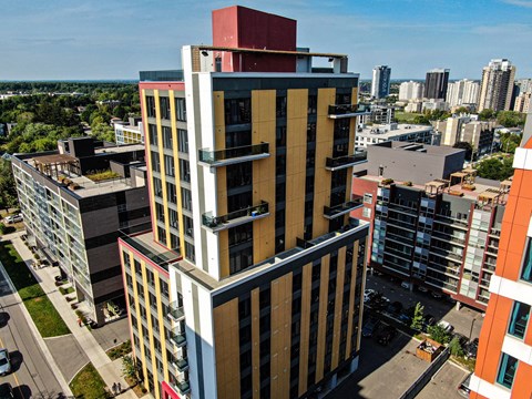 a tall building with a city in the background