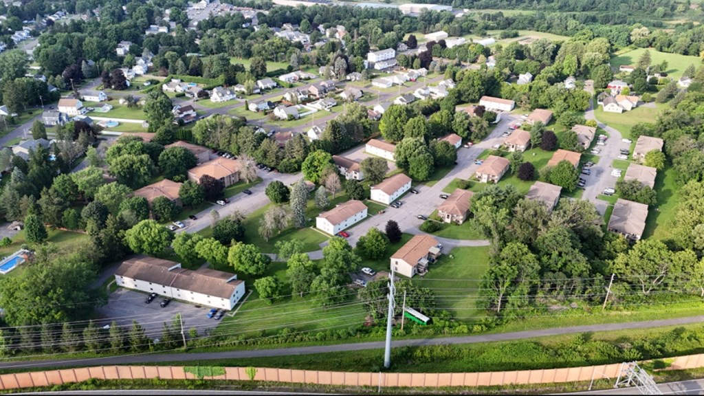 an aerial view of a neighborhood with houses and trees