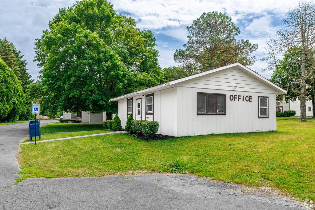 A small white building with the word "OFFICE" on the front.