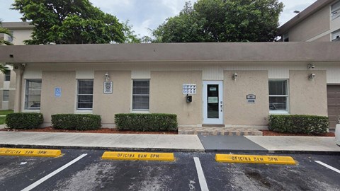 A building with a sign that says "OFFICIAL BAN SPN" on the front.