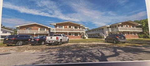 a house with cars parked in front of it