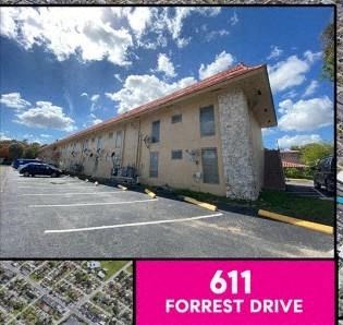 a picture of a building in a parking lot