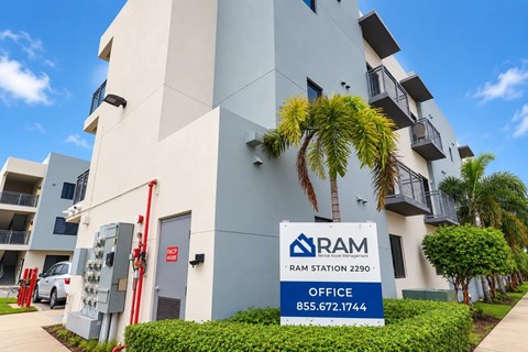 A building with a sign that says RAM STATION 2290 in front of it.