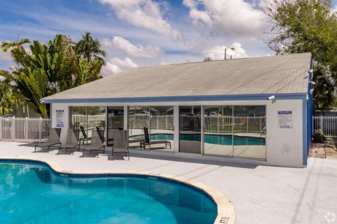 A pool with a building next to it.