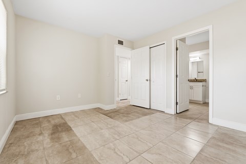 A room with a tile floor and white walls.