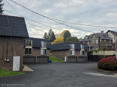 A row of houses with a cloudy sky above them.