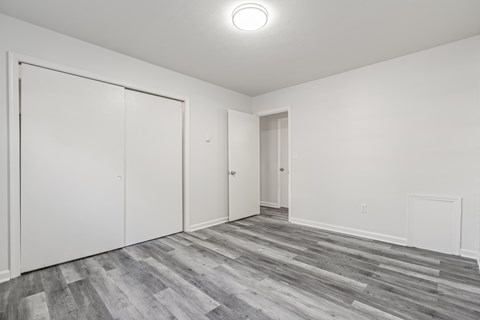 A room with a grey floor and white walls.