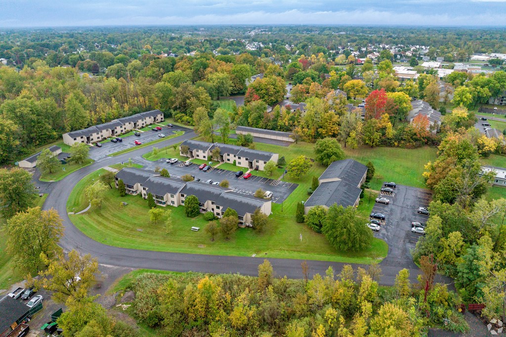 A bird's eye view of a residential area with houses and trees.