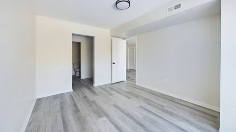 A room with a grey floor and white walls.
