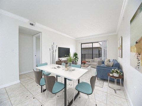a dining room with a table and chairs