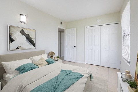 a bedroom with a large bed and a painting on the wall