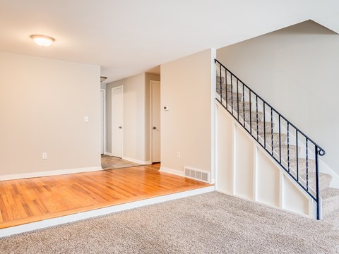 A room with a staircase leading to the upper floor.
