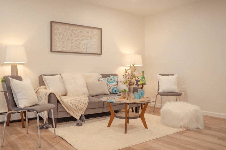 a living room with a couch and a table