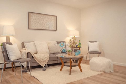 a living room with a couch and a table