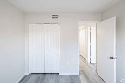 A white door with a window above it.