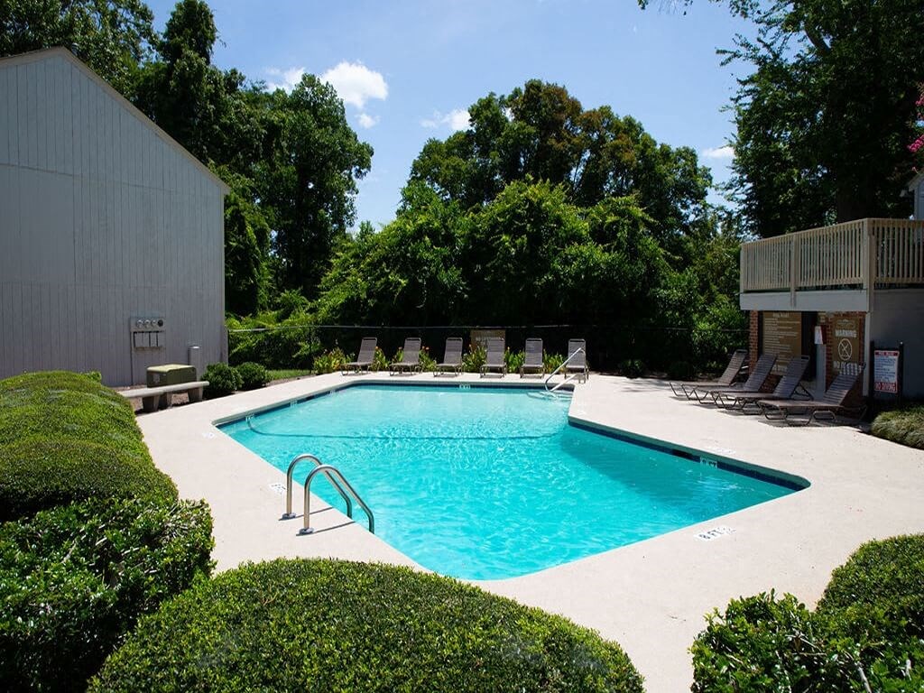 a swimming pool is next to a building