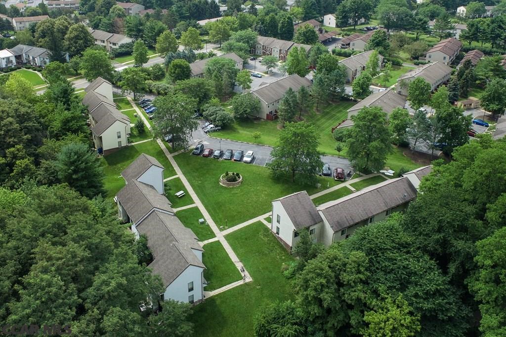 an aerial view of a neighborhood of houses and trees