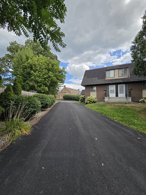 A residential street with houses on both sides.