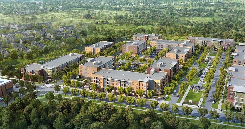 an aerial view of an urban neighbourhood with buildings and trees