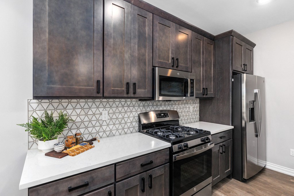 Large Island Kitchen With Custom Cabinetry at Encore at West Valley, White Lake, MI, 48386