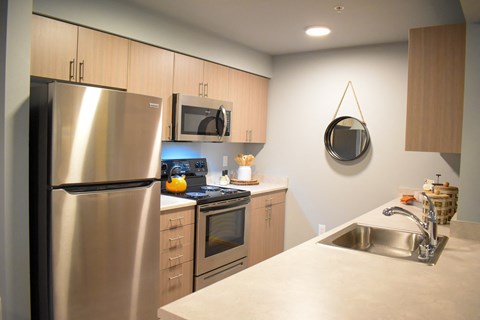 a kitchen with stainless steel appliances and a sink