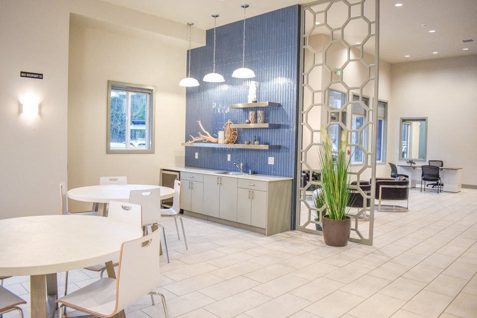 a room with tables and chairs and a counter