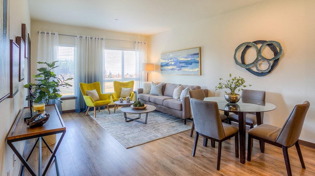 a living room with a couch and a dining table