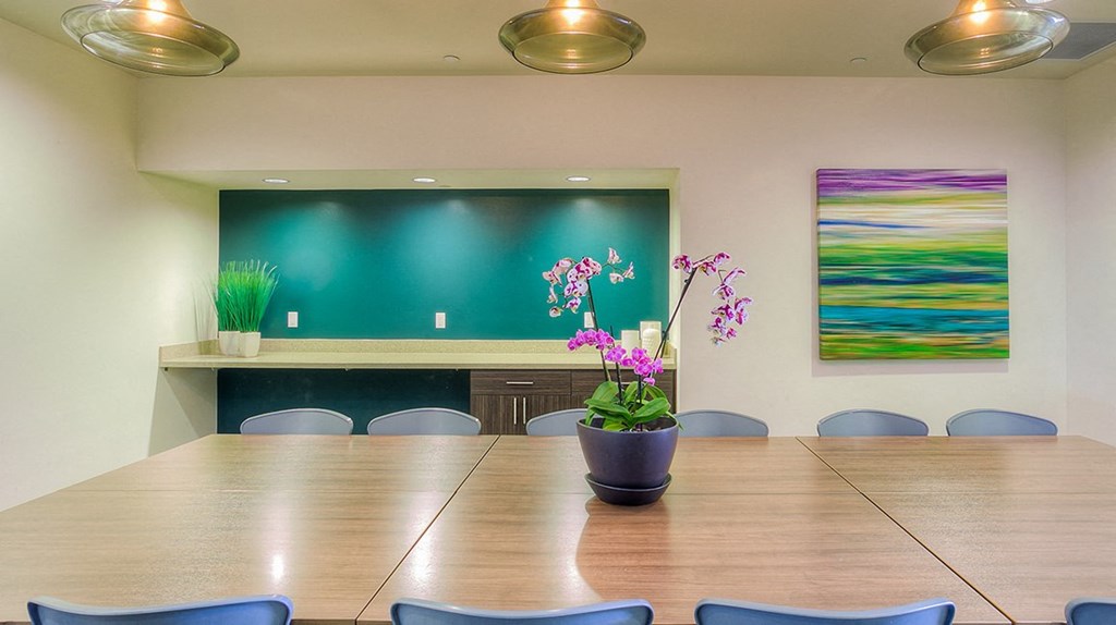 a large conference room with a large table and chairs