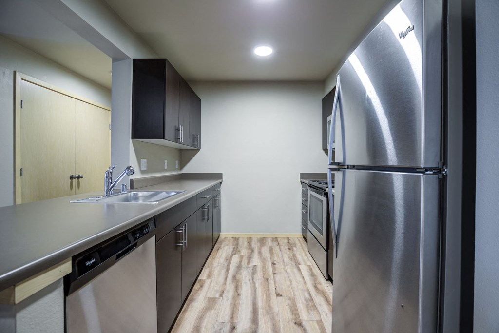 Fully Equipped Kitchen with Refrigerator, Microwave, and dishwasher