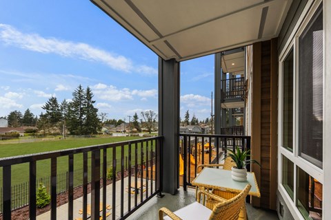 Private apartment patio overlooking the playground at Kendrick Landing Apartments
