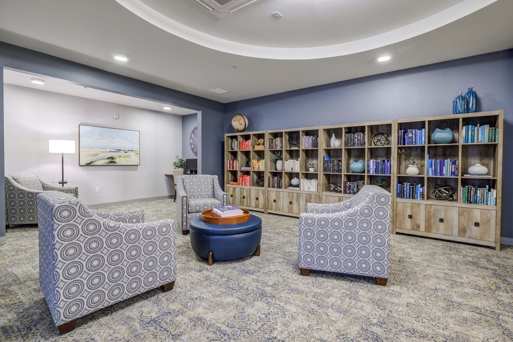 a lobby with chairs and a book shelf at Ovation at Meeker, Kent