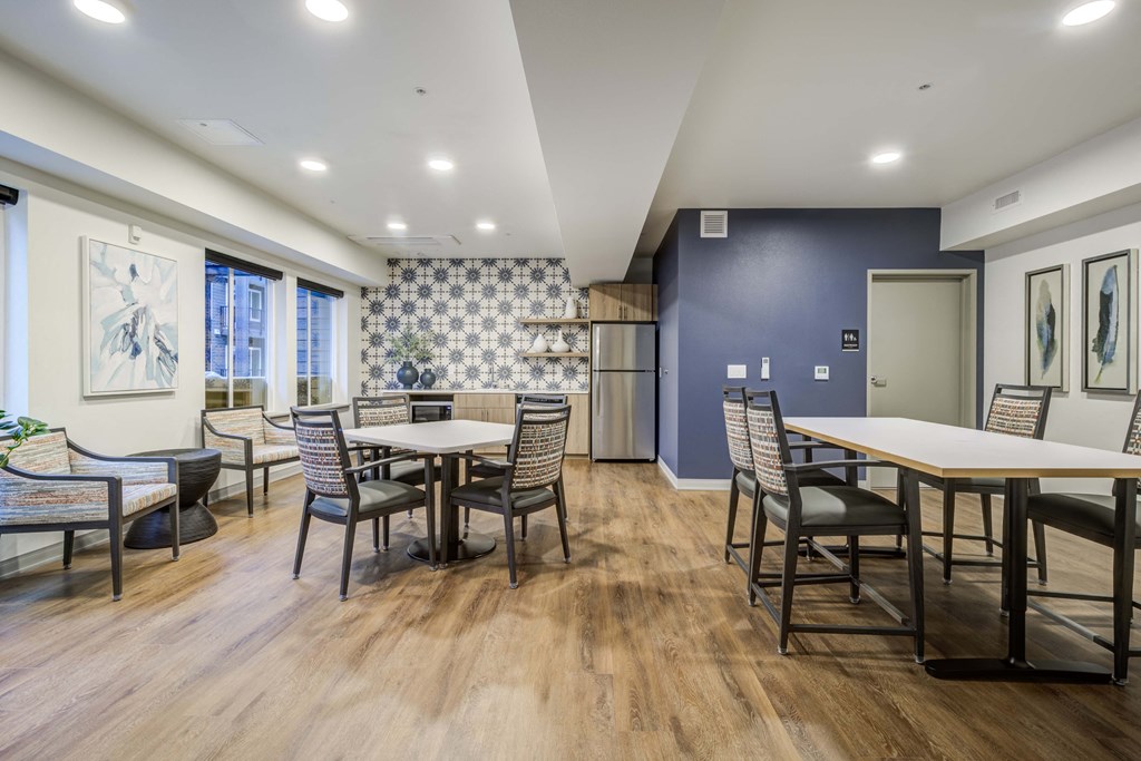 a dining room with tables and chairs and a kitchen at Ovation at Meeker, Washington