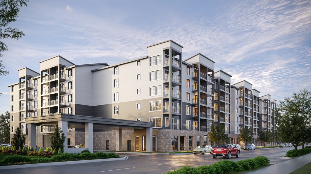 a rendering of a large apartment building with cars parked in front of it at Ovation at Meeker, Kent, WA