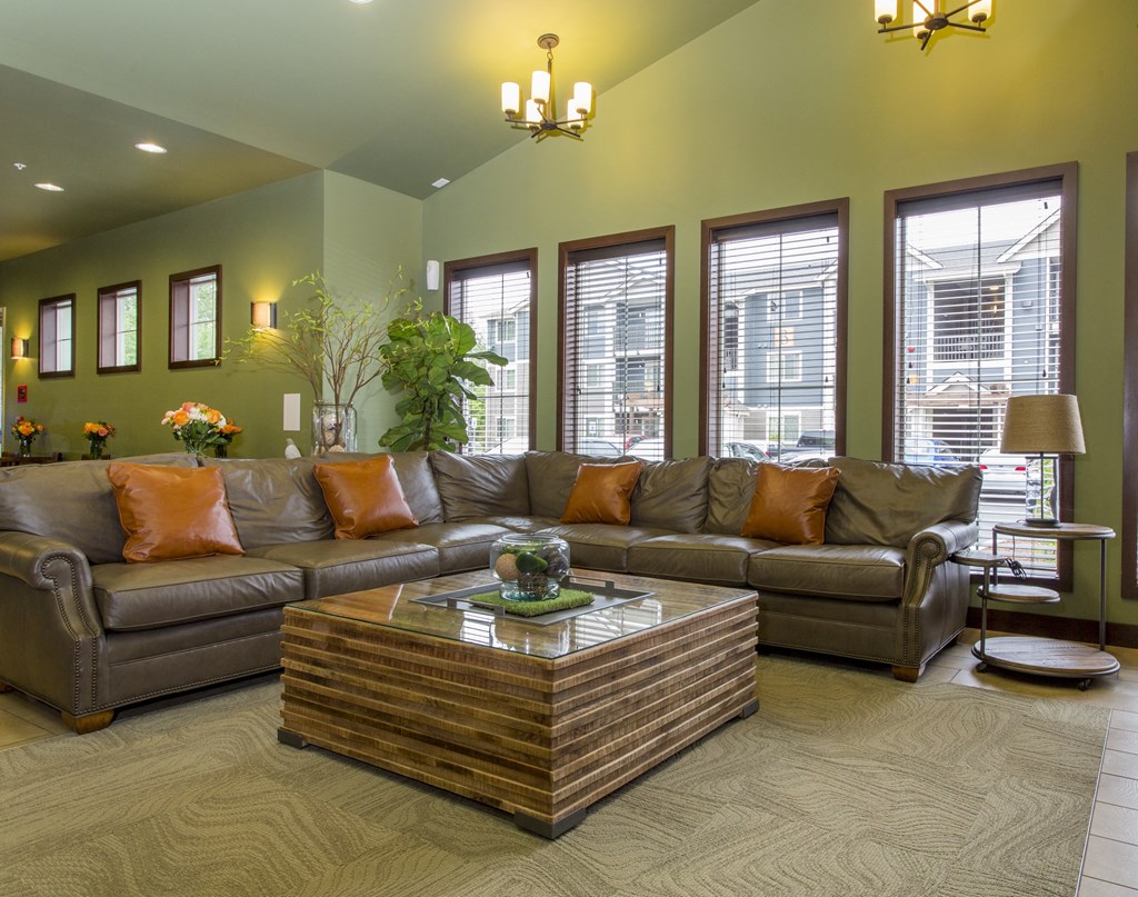 a living room with couches and a coffee table