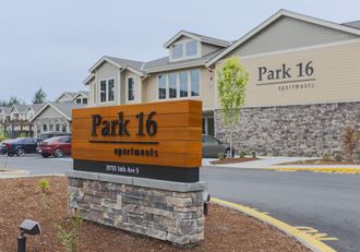 a park 16 sign in front of a building