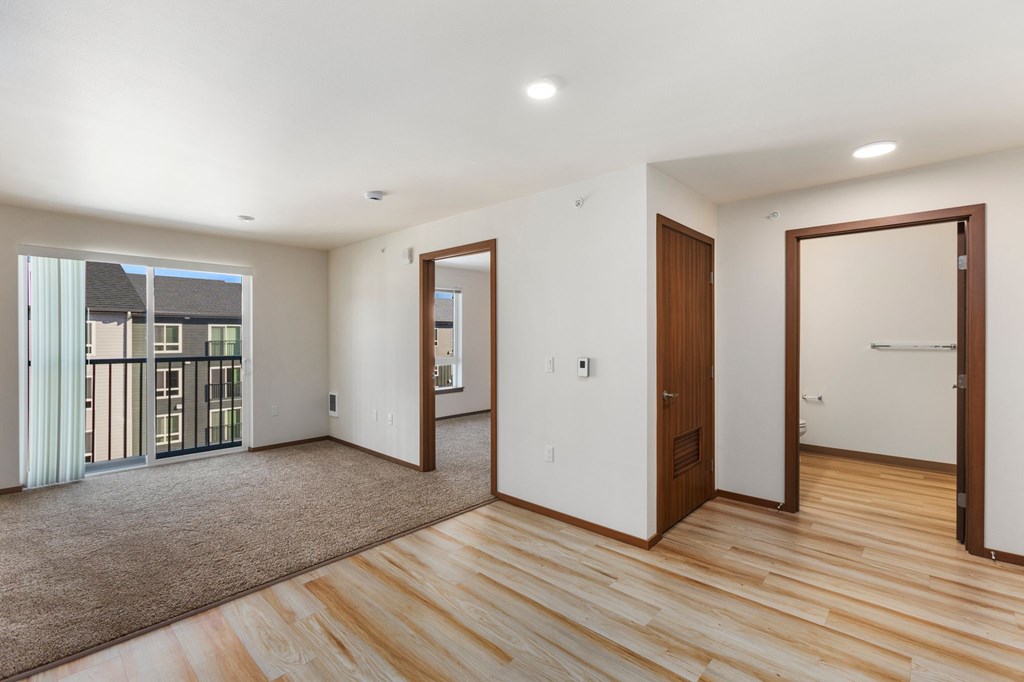 A room with wooden floors and white walls.