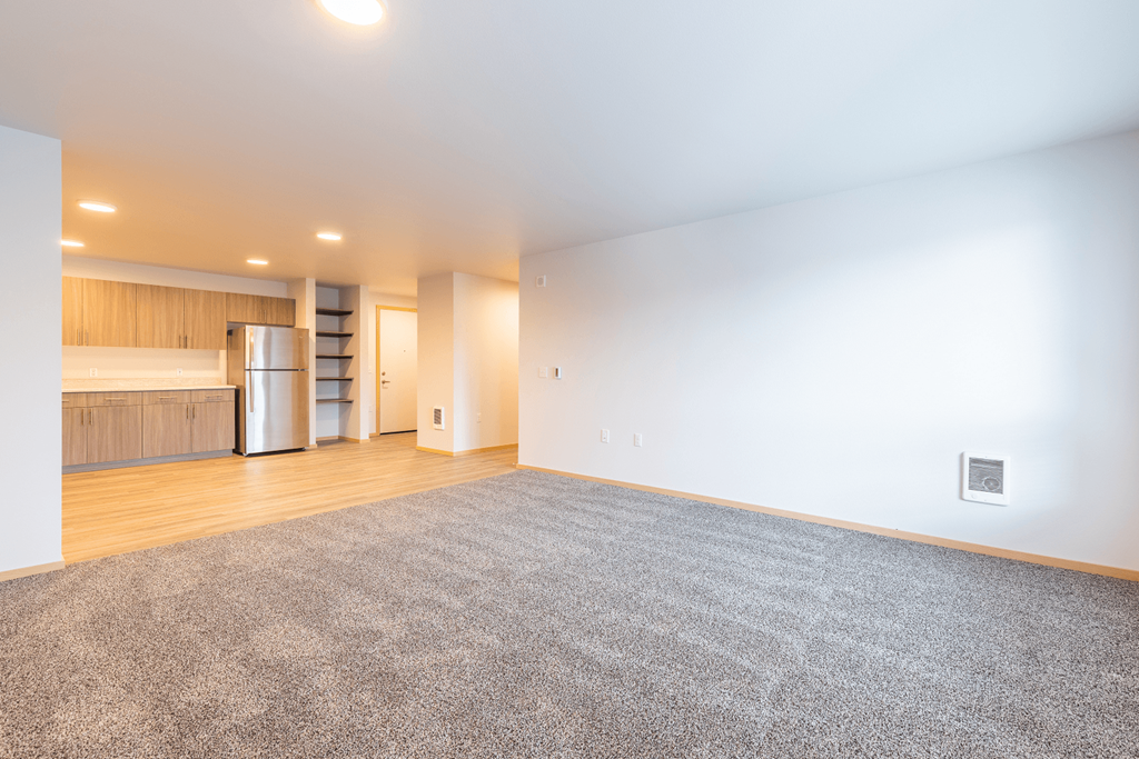 Spacious Living Room with Carpet and kitchen view
