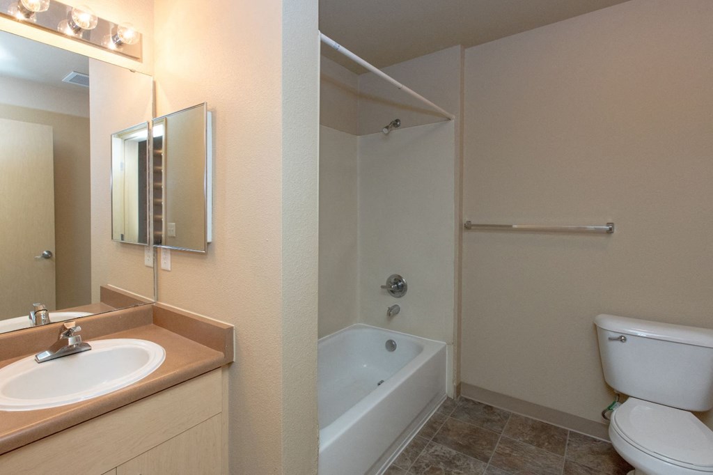the preserve at ballantyne commons apartment bathroom with sink toilet and shower