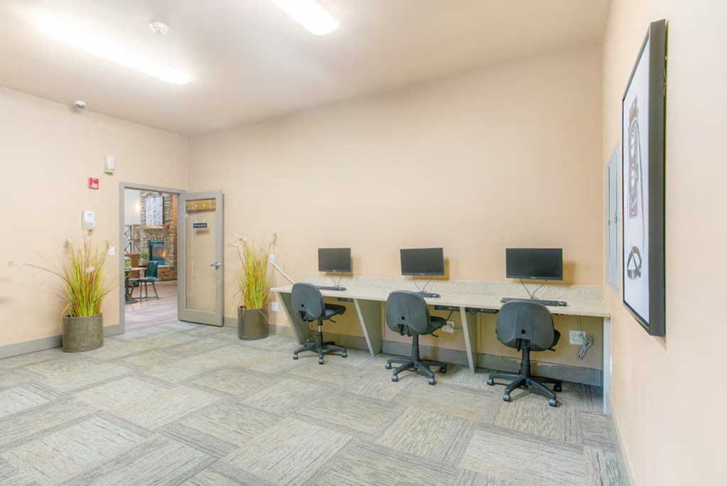 a large office with desks and chairs in it