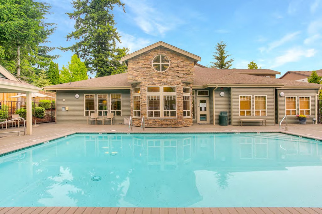 a swimming pool in front of a house