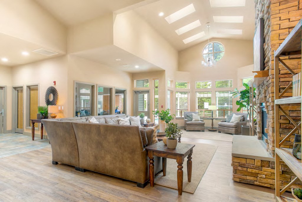 a large living room with a couch and a fireplace