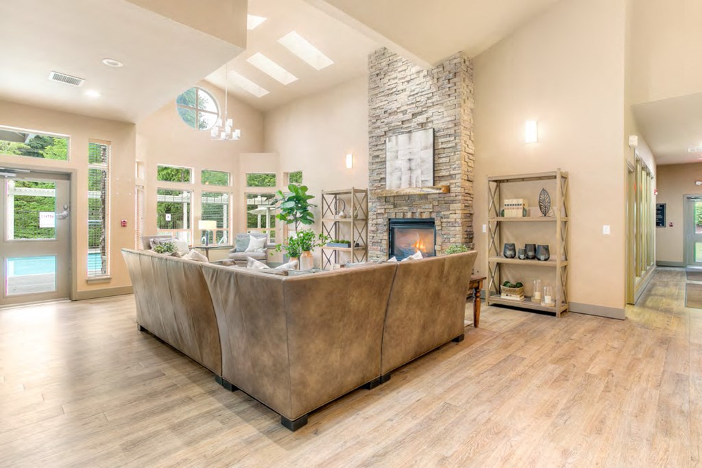a living room with a couch and a fireplace