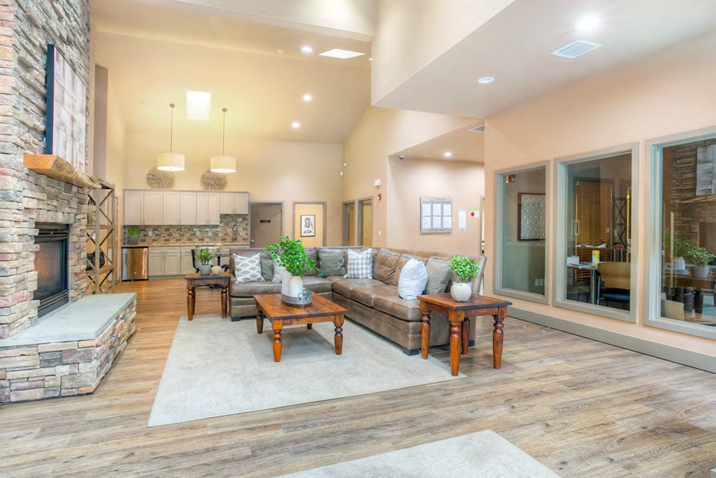 a living room with a couch and a fireplace