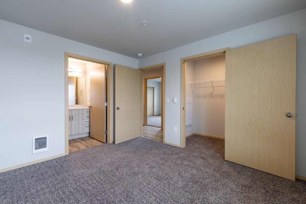 Bedroom with bathroom and closet
