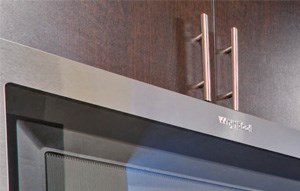 a kitchen with stainless steel appliances and a stainless steel refrigerator